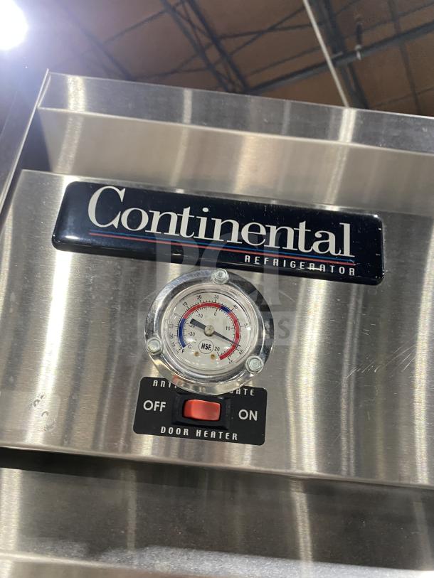 Continental stainless steel 2-door Dutch style reach-in refrigerator, Model 1REHD, with rack and shelf, temperature gauge, and door heater control.