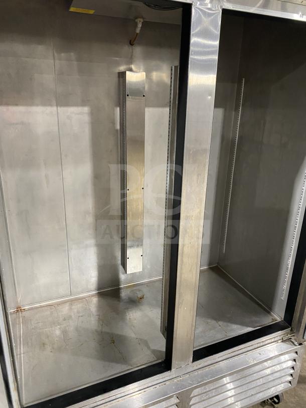 Asber 2019 commercial stainless steel 2-door reach-in freezer, model ARF49HFHC, on casters, showing interior condition.