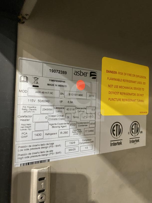 Asber 2019 commercial freezer, model ARF49HFHC, stainless steel, 2 doors, on casters. Contains tag with specifications.