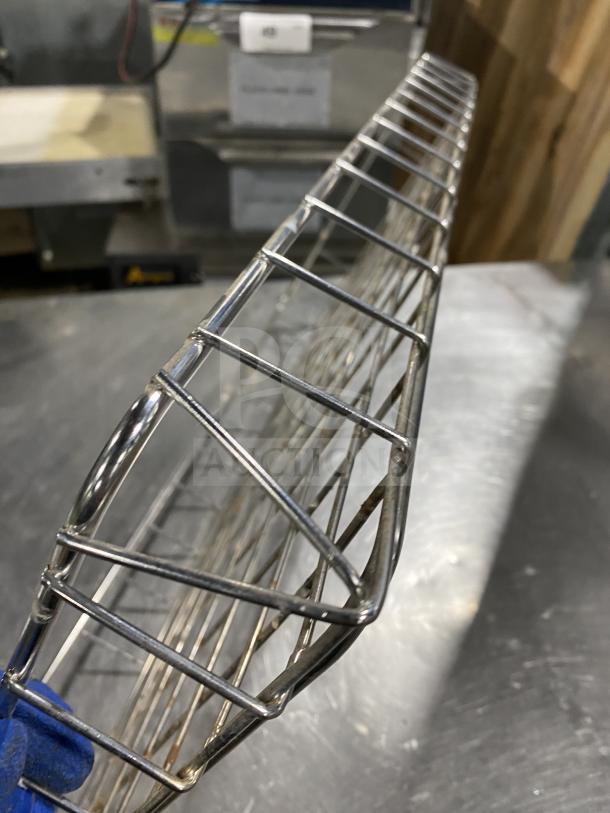 Commercial stainless steel bagel wrap rack, durable wireframe design, excellent condition, ideal for foodservice use.