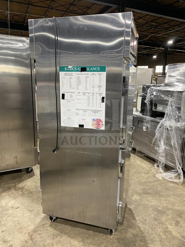 Continental commercial stainless steel 2-door reach-in refrigerator, model 1RE-PT-HD, on casters, with rack and shelf, good condition.