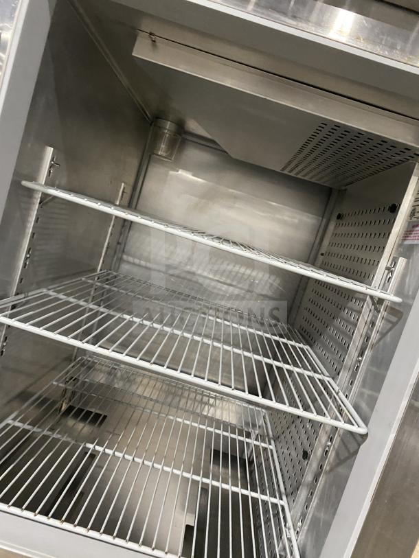 Continental 2-Door Stainless Steel Refrigerator, Model 1RE-PT-HD, with rack and shelf. Excellent condition, on casters.