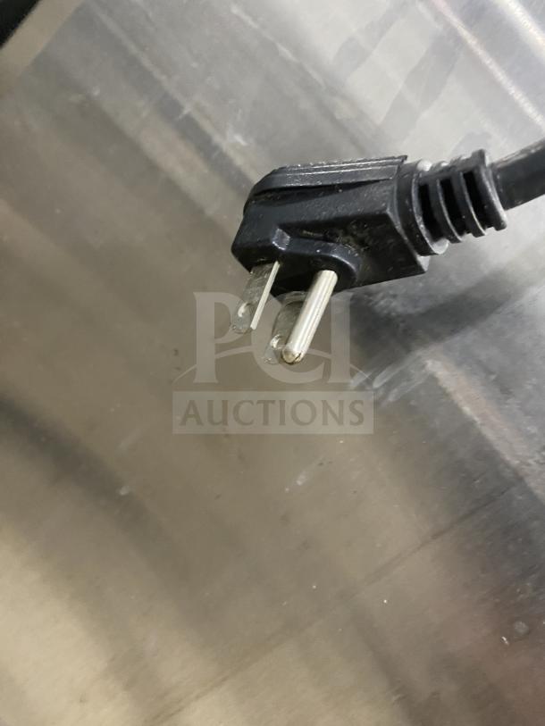 Continental 2-Door Dutch Style Reach-In Refrigerator, Model 1RE-PT-HD. Stainless steel, on casters, features rack and shelf.