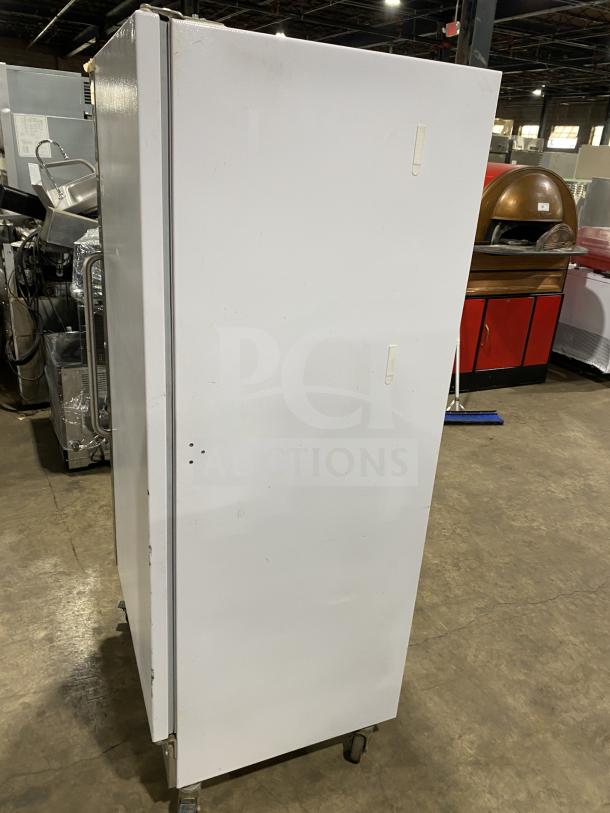 Arctic Air commercial freezer, model F22CW7, white exterior, stainless steel, on casters, electric-powered, reach-in style.