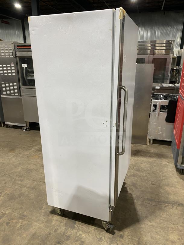 Arctic Air F22CW7 stainless steel reach-in freezer, white exterior, on casters, electric, model SN: WB91910324, 115V.