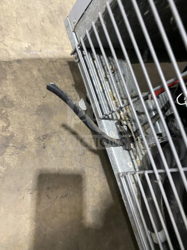 Economy ER1AFS stainless steel single-door refrigerator on casters, poly-coated wire rack, Energy Star certified, model ER1A-FS SN: L01657H, 115V.