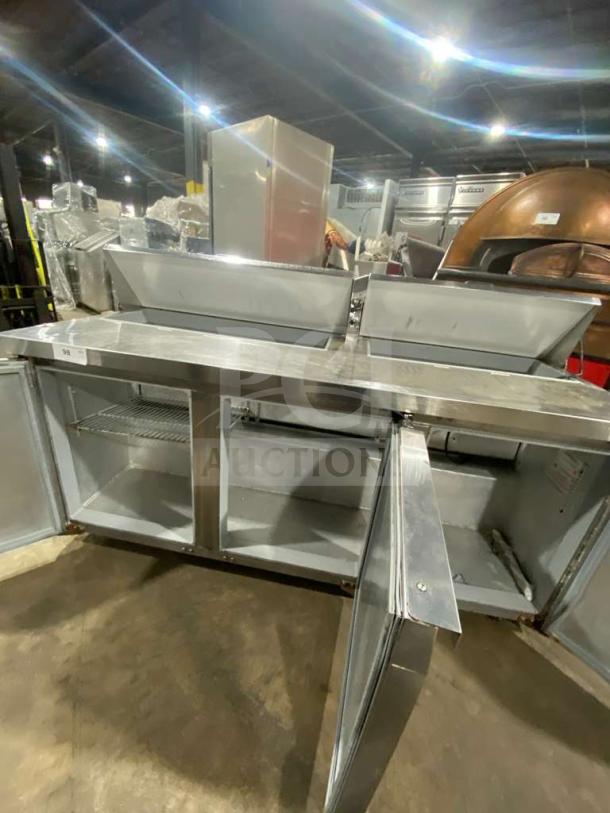 Continental SW7218 stainless steel 3-door refrigerated prep table, 72-inch, with poly-coated wire rack, on casters.