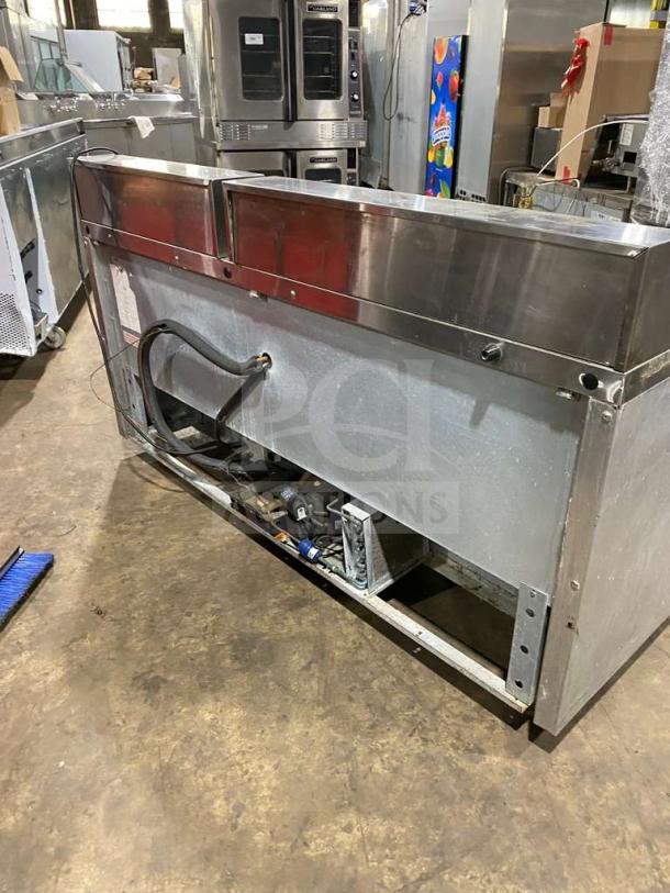 Continental SW72-18 stainless steel 3-door refrigerated bain marie prep table on casters, visible wiring and components.