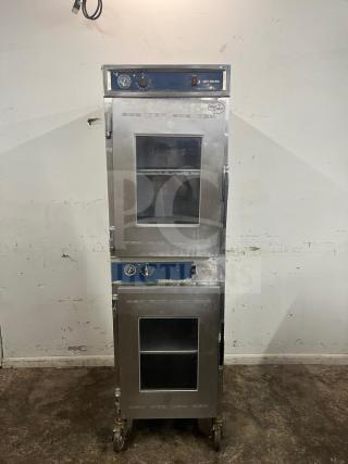 Alto-Shaam 1000-UP Holding Cabinet, 120V, stainless steel, dual doors with glass panels, on casters, used condition.