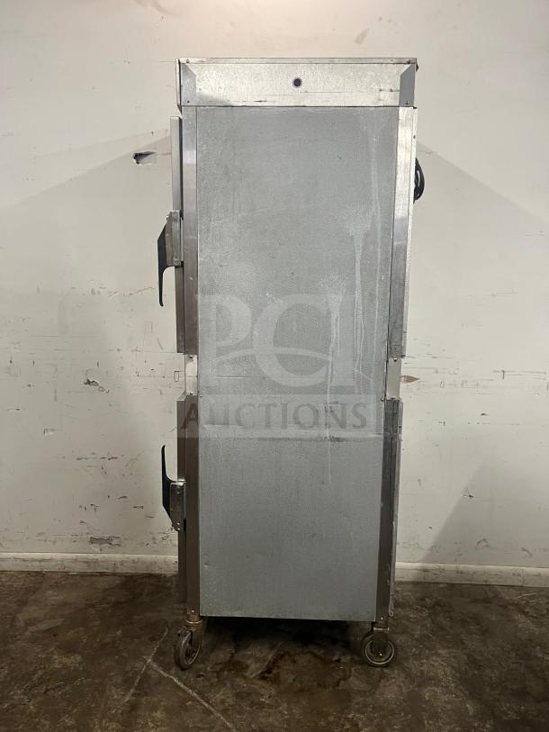 Alto-Shaam 1000-UP holding cabinet, 120V, stainless steel, dual door, wheeled base, in fair condition.