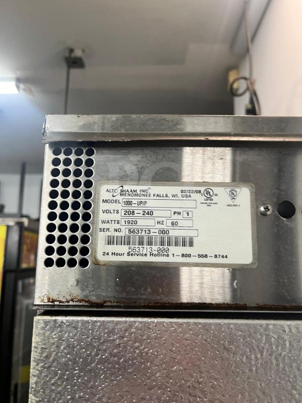 Alto-Shaam 1000-UP Holding Cabinet, model 1000-UP, 120V, shows label with specs and serial number, visible light wear.