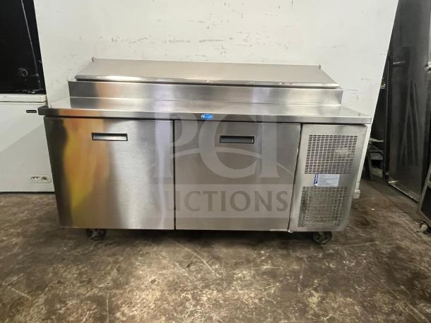 Randell 8268N 68" 2-section refrigerated pizza prep table, stainless steel, with 2 doors, 17.76 cu. ft., on wheels.