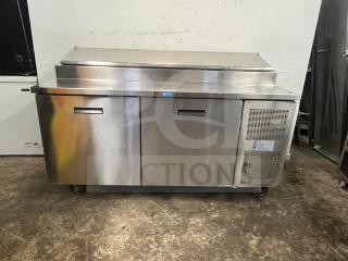 Randell 8268N 68" 2-section refrigerated pizza prep table, stainless steel, with 2 doors, 17.76 cu. ft., on wheels.