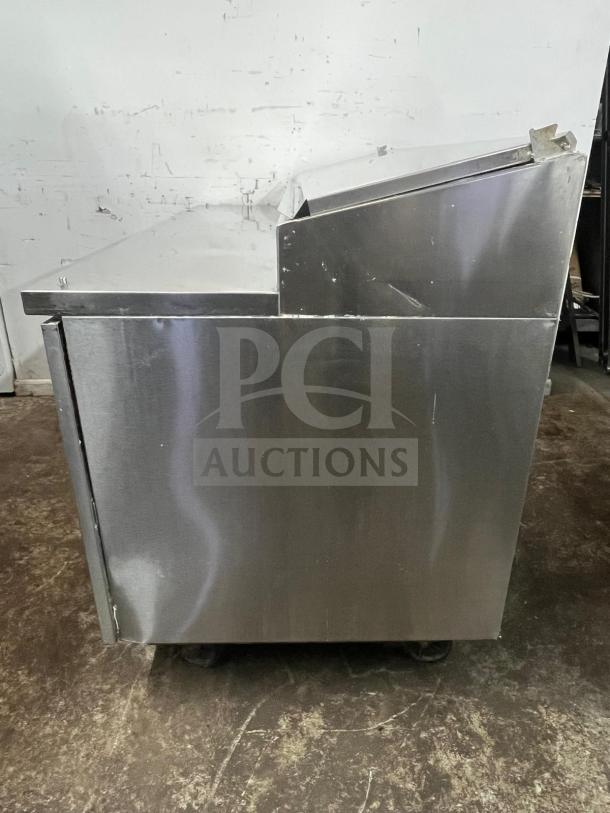 RANDELL 8268N-290-PCB pizza prep table, 68", stainless steel, 2-section with 2 doors, 17.76 cu. ft., slight wear visible.