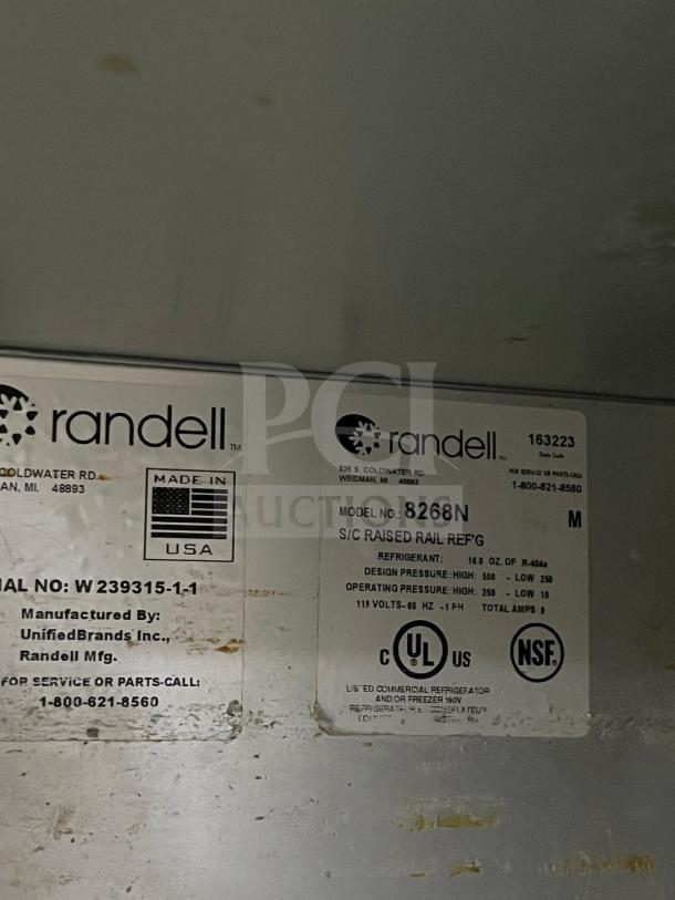 Label inside a Randell 8268N refrigerated pizza prep table, showing model, serial number, and specifications.