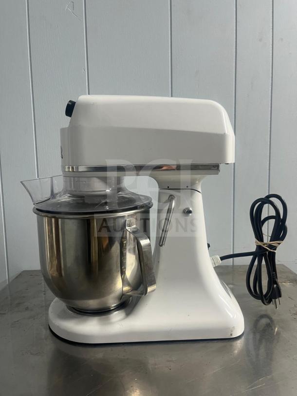 Primo PM7 commercial planetary mixer, 7-quart capacity, in good condition. Features stainless steel bowl and plastic guard.
