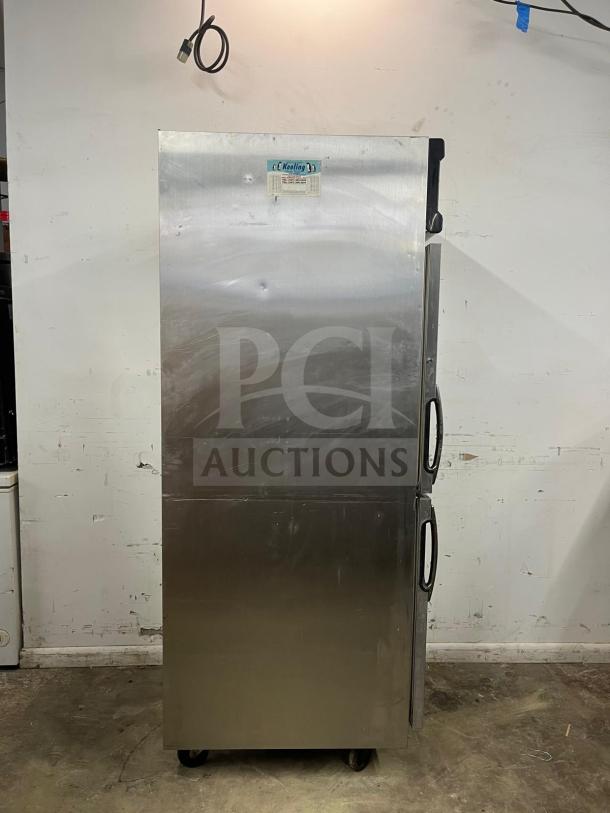 ColdTech Two Solid Half Door Freezer, stainless steel, Model j2sff-21b, energy-saving, visible wear, on wheels.