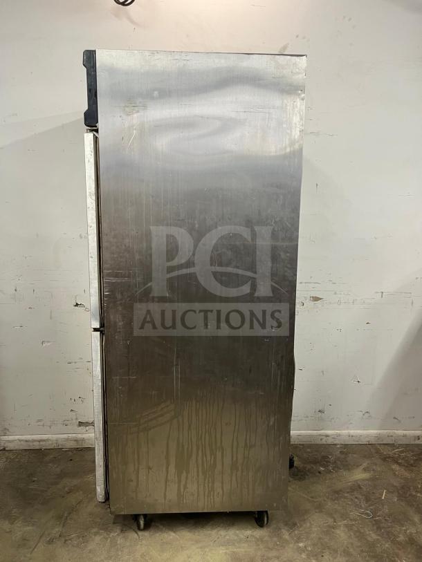 ColdTech Two Solid Half Door Freezer, stainless steel, model j2sff-21b. Energy-saving, visible wear, on wheels.