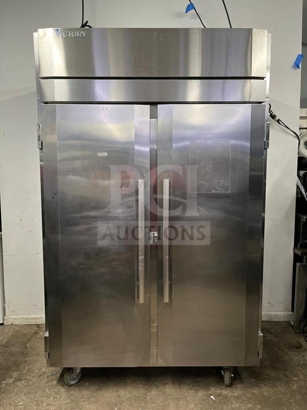 VICTORY ULTRASPEC roll-thru refrigerator, stainless steel, solid doors, front and rear access, on casters, excellent condition.
