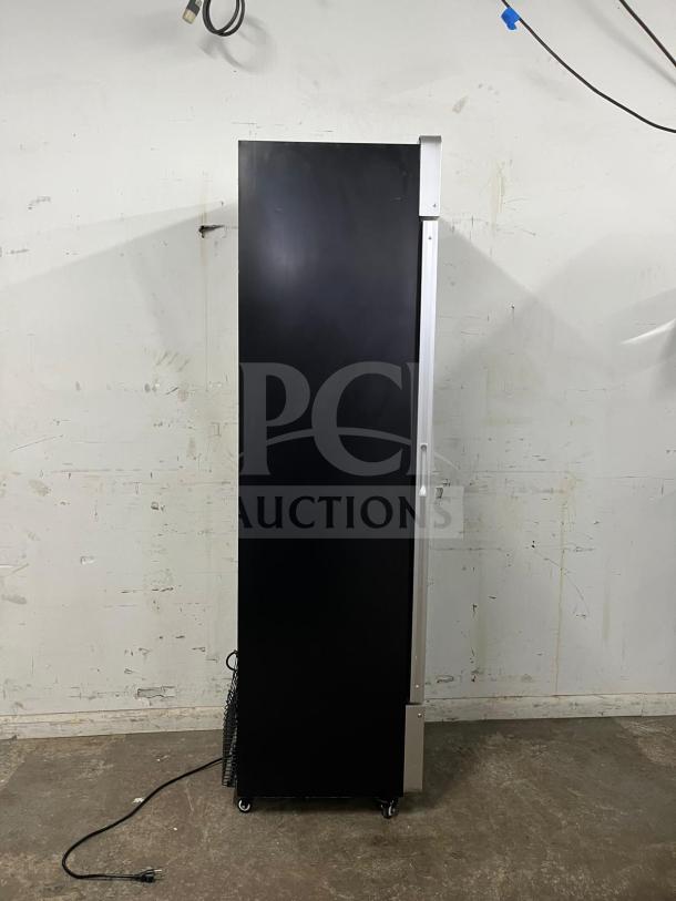 Yukon USF-175BLK commercial freezer, single glass door, black exterior, upright design, visible power cord, on casters.