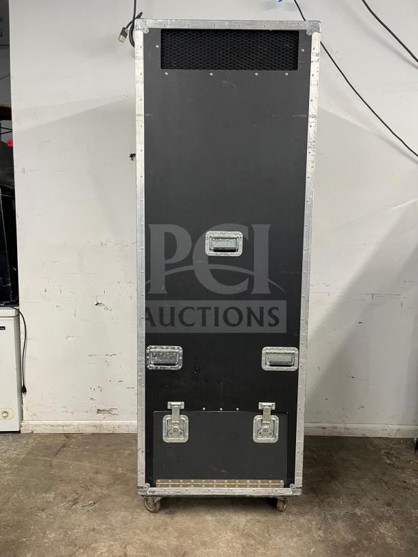 TRUE GDM-19T-LD refrigerated merchandiser in black, shown in its sturdy travel case with secure latches and handles.