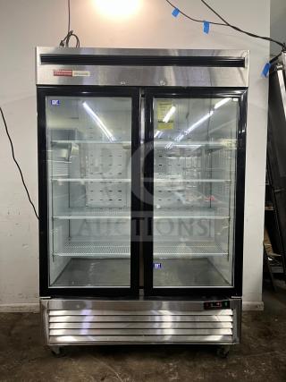 North American Precision Series A2GDF double glass door merchandiser freezer, silver, spacious interior, clean condition.