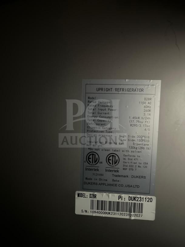 Alt text: Traulsen G10010 refrigerator label showing voltage, frequency, input power, capacity, and model number D28R.