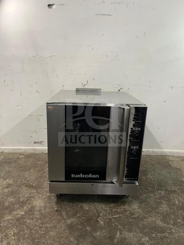 MOFFAT Turbofan single full-size gas convection oven, stainless steel, 33,000 BTU, excellent condition, model uncertain.
