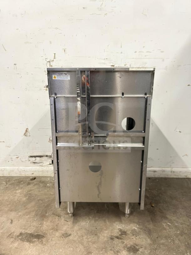 Perlick SC24-18 24" stainless steel storage cabinet with open base and shelves, featuring visible wear, on adjustable legs.