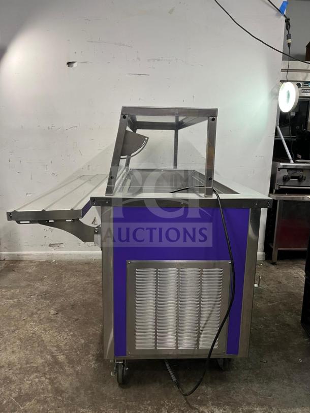 Brand new Delfield SCSC-60-EEP refrigerated food prep table, 60-inch, stainless steel, with a purple accent panel.