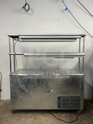 Leader LB48 under counter refrigerator, 48", with 2 full and 1/2 door, double shelves, heat lamp, visible wear.