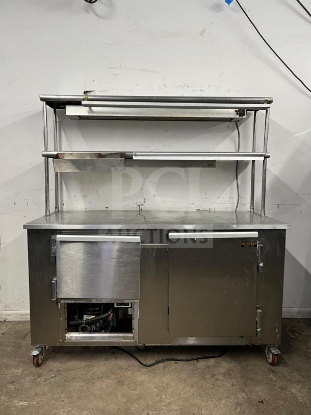 Leader LB48 under counter refrigerator, stainless steel, 48", 2 full and 1 half door, double shelves, heat lamp, used condition.