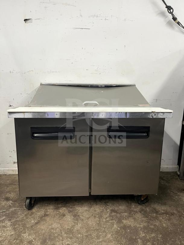 Blue Air BLMT48-HC 48" refrigerated prep table with two swing doors, 13.1 cu. ft., stainless steel, on casters.