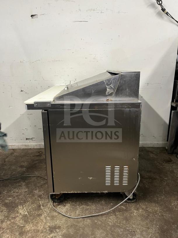 Blue Air BLMT48-HC 48" refrigerated prep table with two swing doors, stainless steel, used condition, visible wear.