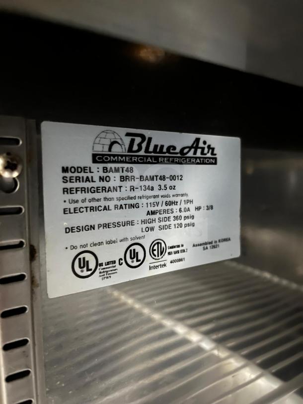 Blue Air BLMT48-HC 48" refrigerated prep table label showing model, serial number, refrigerant, and electrical specs.