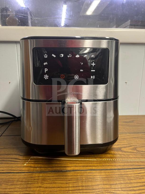 Insignia™ 5 Qt. Digital Air Fryer in stainless steel, with touch controls, in excellent condition, model visible.