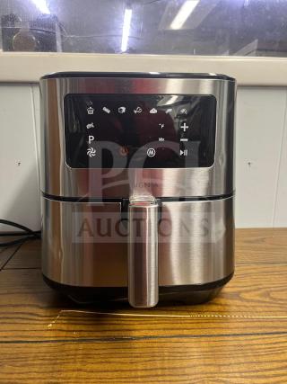 Insignia™ 5 Qt. Digital Air Fryer in stainless steel, with touch controls, in excellent condition, model visible.