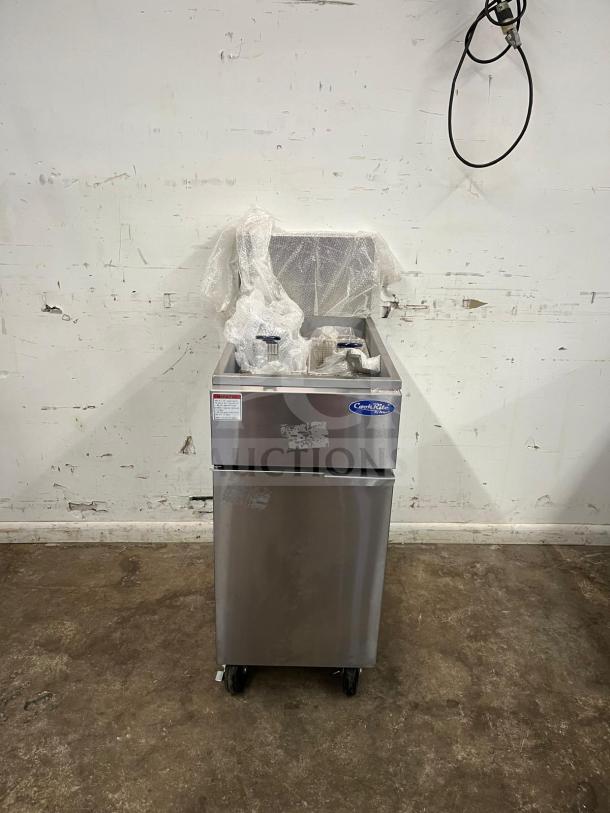 Brand new Atosa ATFS-50 CookRite 50 lb heavy-duty gas fryer with 4 burners, stainless steel, protective wrapping visible.