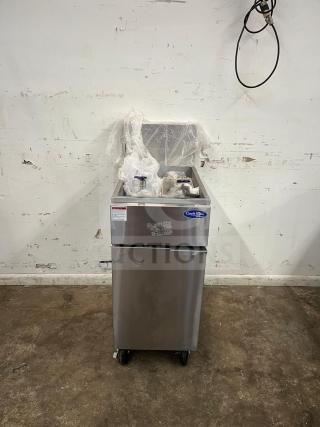 Brand new Atosa ATFS-50 CookRite 50 lb heavy-duty gas fryer with 4 burners, stainless steel, protective wrapping visible.