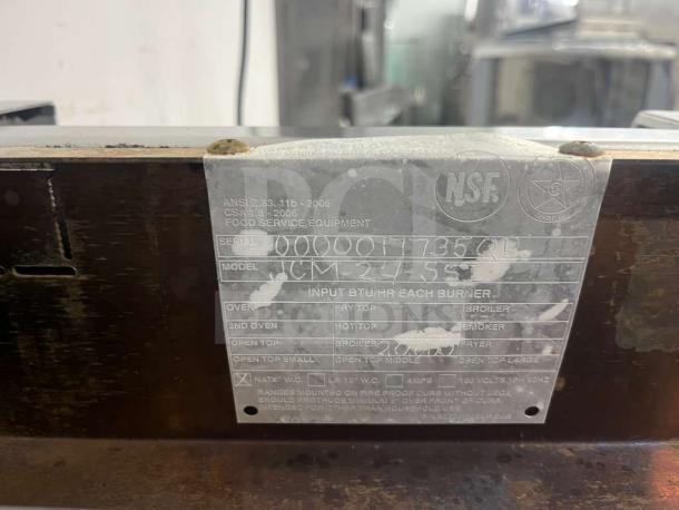 Jade Range JCM-24 gas cheesemelter with 24-inch infrared burners, 20,000 BTU, used condition, NSF certified label visible.