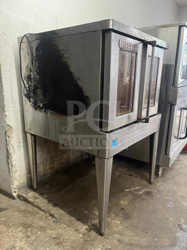 Blodgett BDO-100-G-ES convection oven showing signs of use; stainless steel, two-door model with visible wear and manufacturer logo.