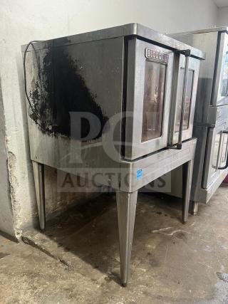 Blodgett BDO-100-G-ES convection oven showing signs of use; stainless steel, two-door model with visible wear and manufacturer logo.