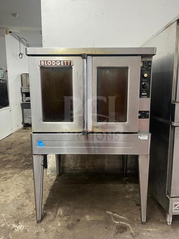 Blodgett BDO-100-G-ES convection oven, stainless steel, dual glass doors, floor model, visible brand labeling, used condition.