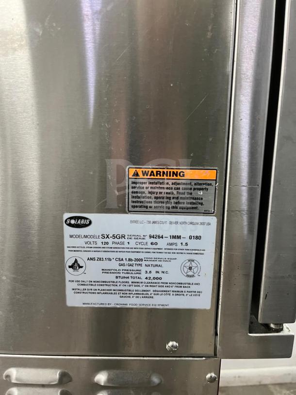 SOLARIS SX-5GR natural gas convection steamer with cooling racks. Model label indicates 42,000 BTU. Stainless steel exterior.