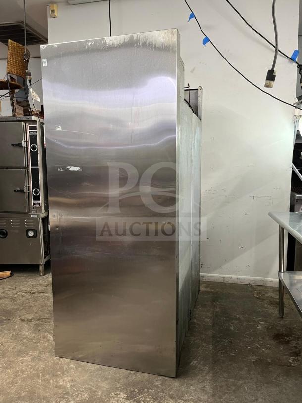 Traulsen RHT232NUT-HHS stainless steel 46 cu. ft. two-section narrow reach-in refrigerator, good condition.