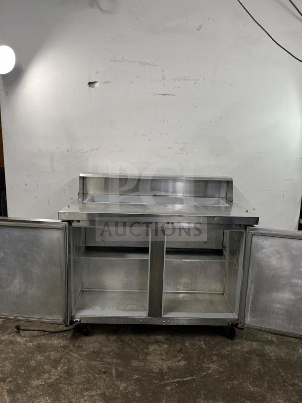 Continental SW48-12 Refrigerated Sandwich Prep Unit, 48" stainless steel, 13.4 cu ft, dual doors, good condition.