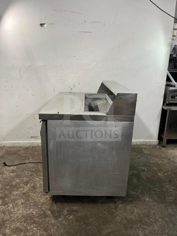 Continental SW48-12 refrigerated sandwich prep unit, 48", 13.4 cu ft. Stainless steel, used condition, side view.