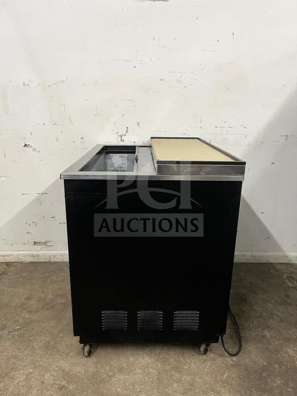 True T-36-GC-HC black glass froster, model T-36-GC-HC, in good condition, on wheels, with stainless steel top.