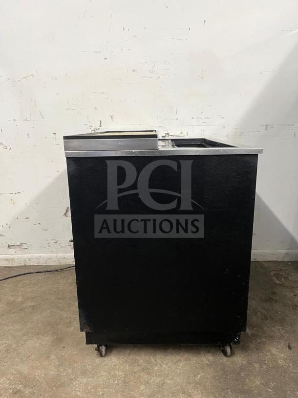 True T-36-GC-HC black glass froster, 36 3/4", on wheels, used condition, ideal for chilling glassware and plates.