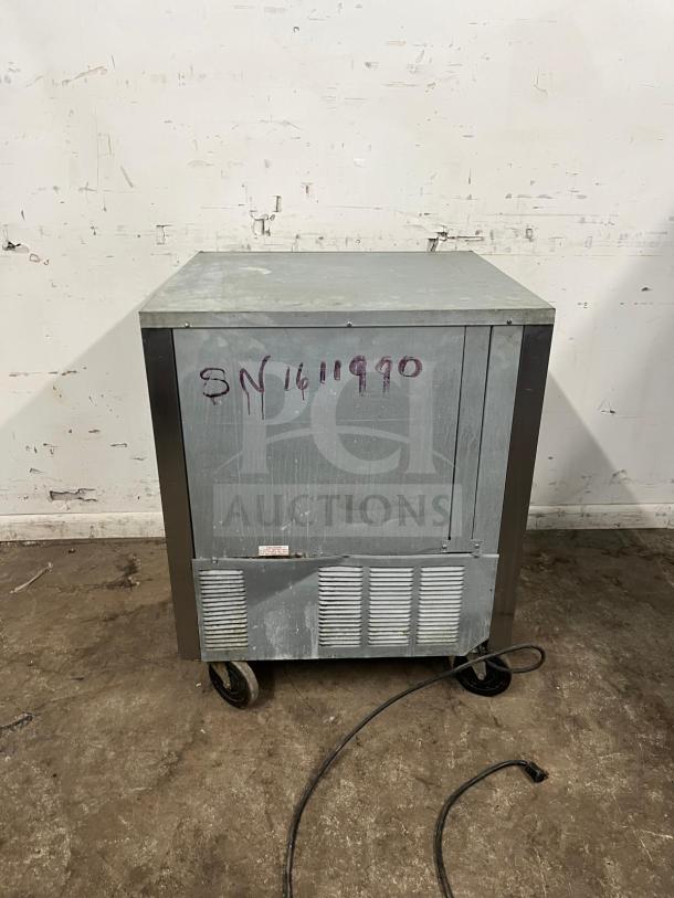 Beverage-Air 27" undercounter refrigerator on wheels, visible serial number SN1411990, in used condition.